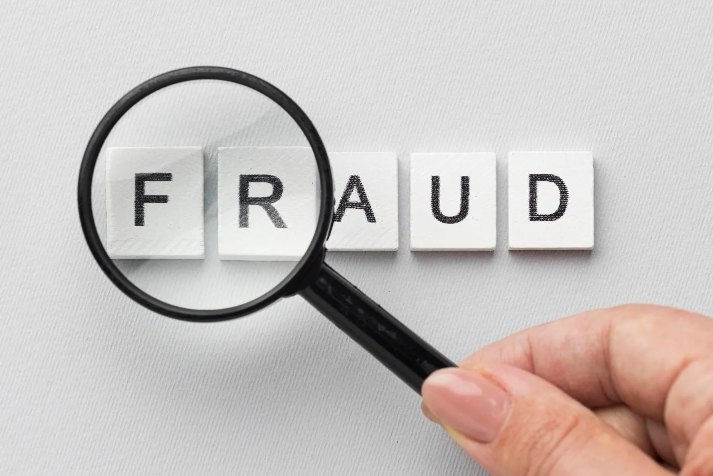 C:\Users\admin\Downloads\fraud-word-magnifying-glass.jpg